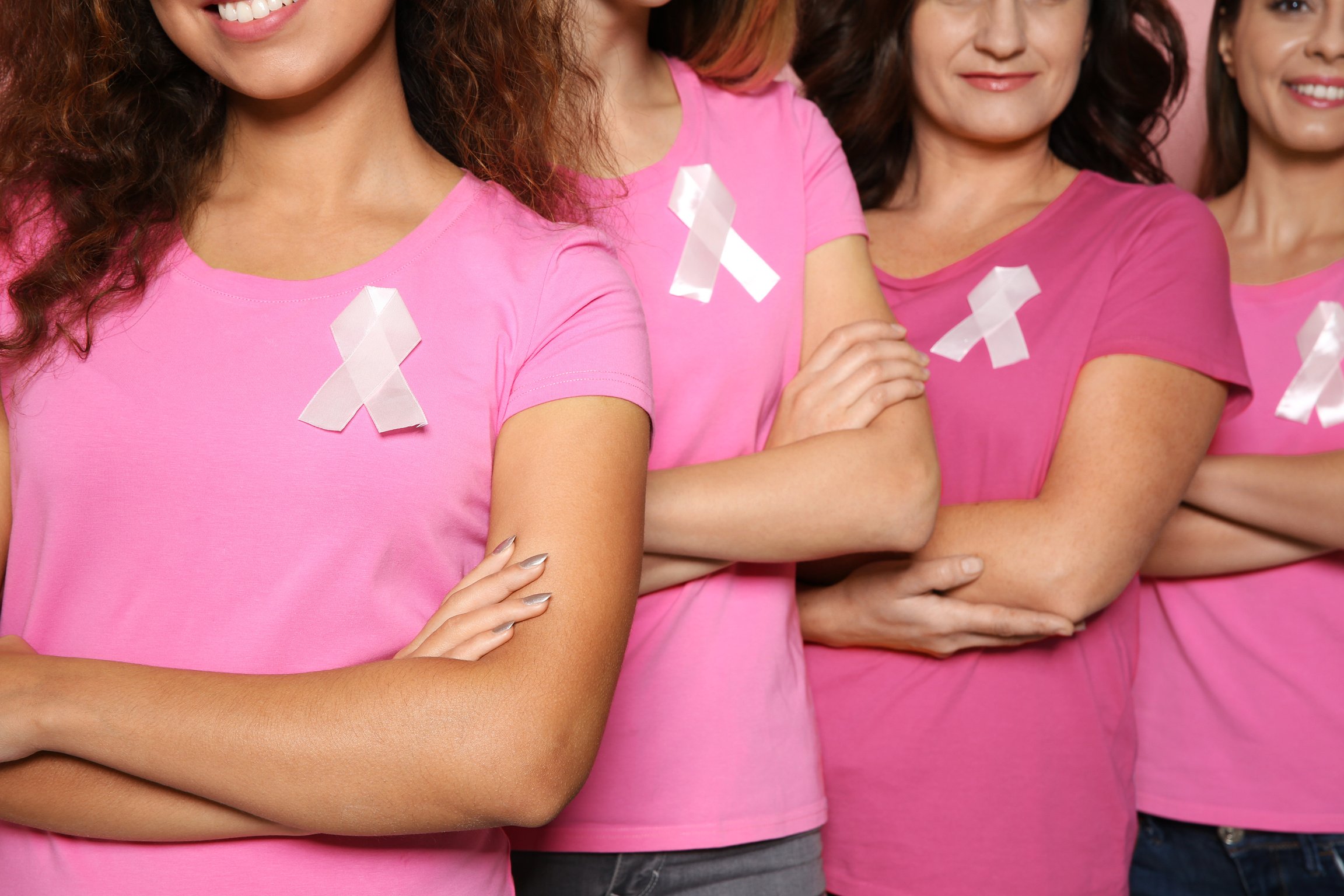 Group of Women with Silk Ribbons, Closeup. Breast Cancer Awareness Concept